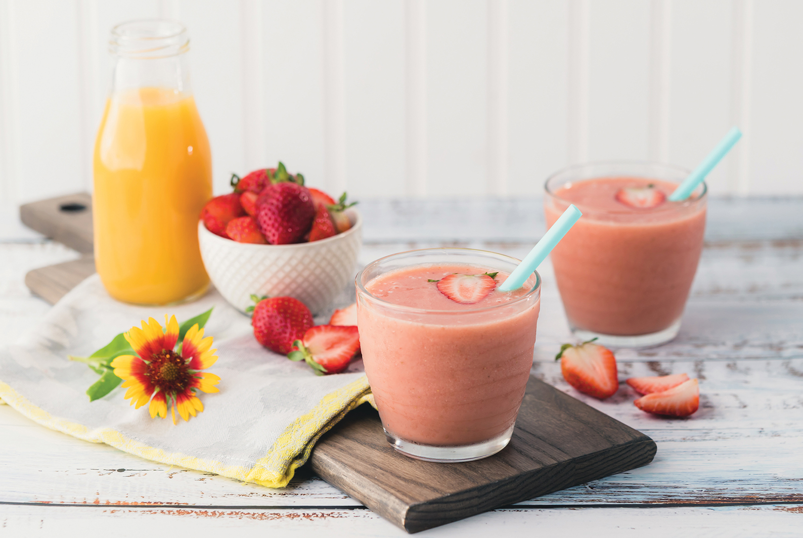 glasses of strawberry banana smoothie with orange juice