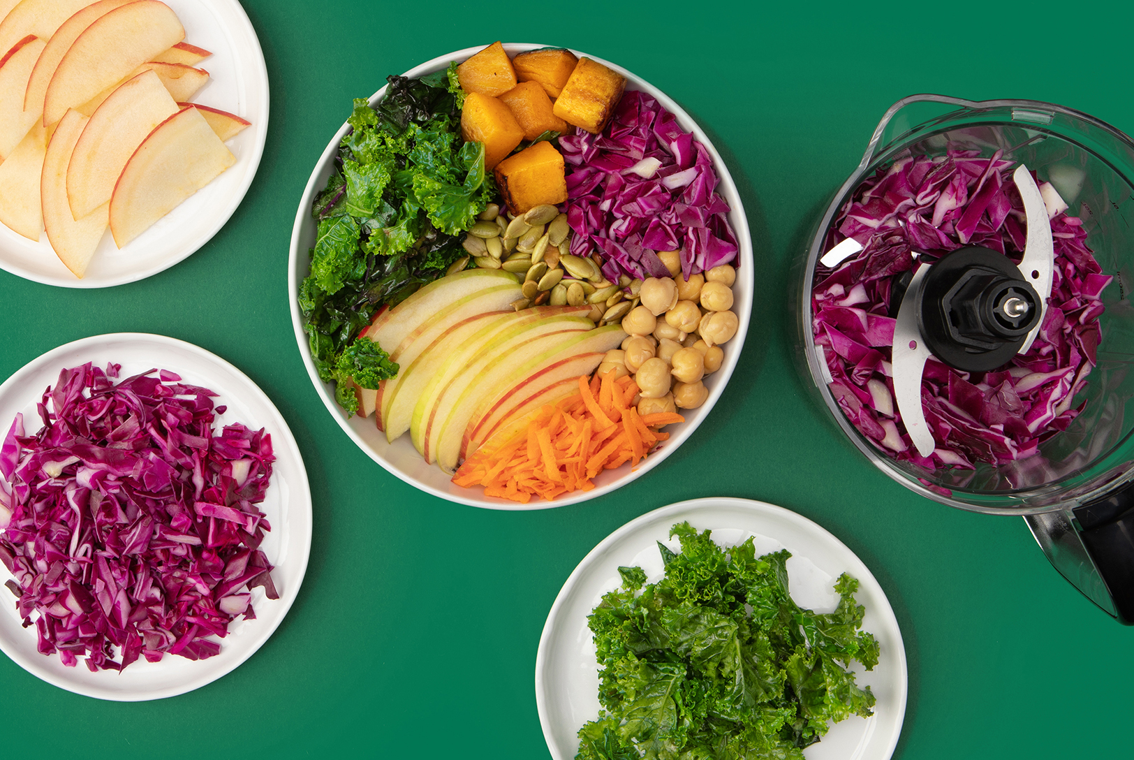 greens and grains bowl with butternut squash, apples, cabbage, carrots and chickpeas
