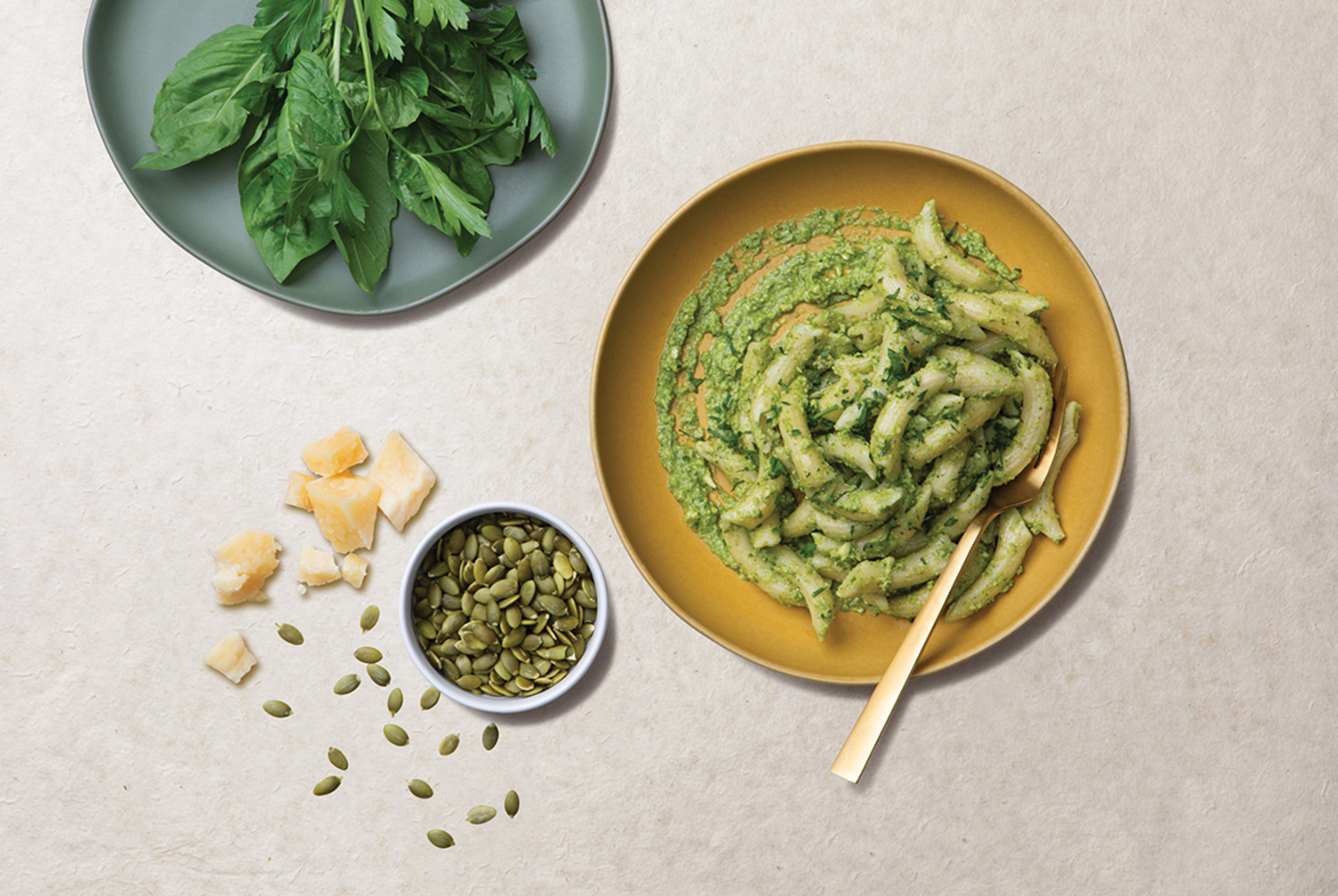 plate of pasta with broccoli basil pesto and parmesan