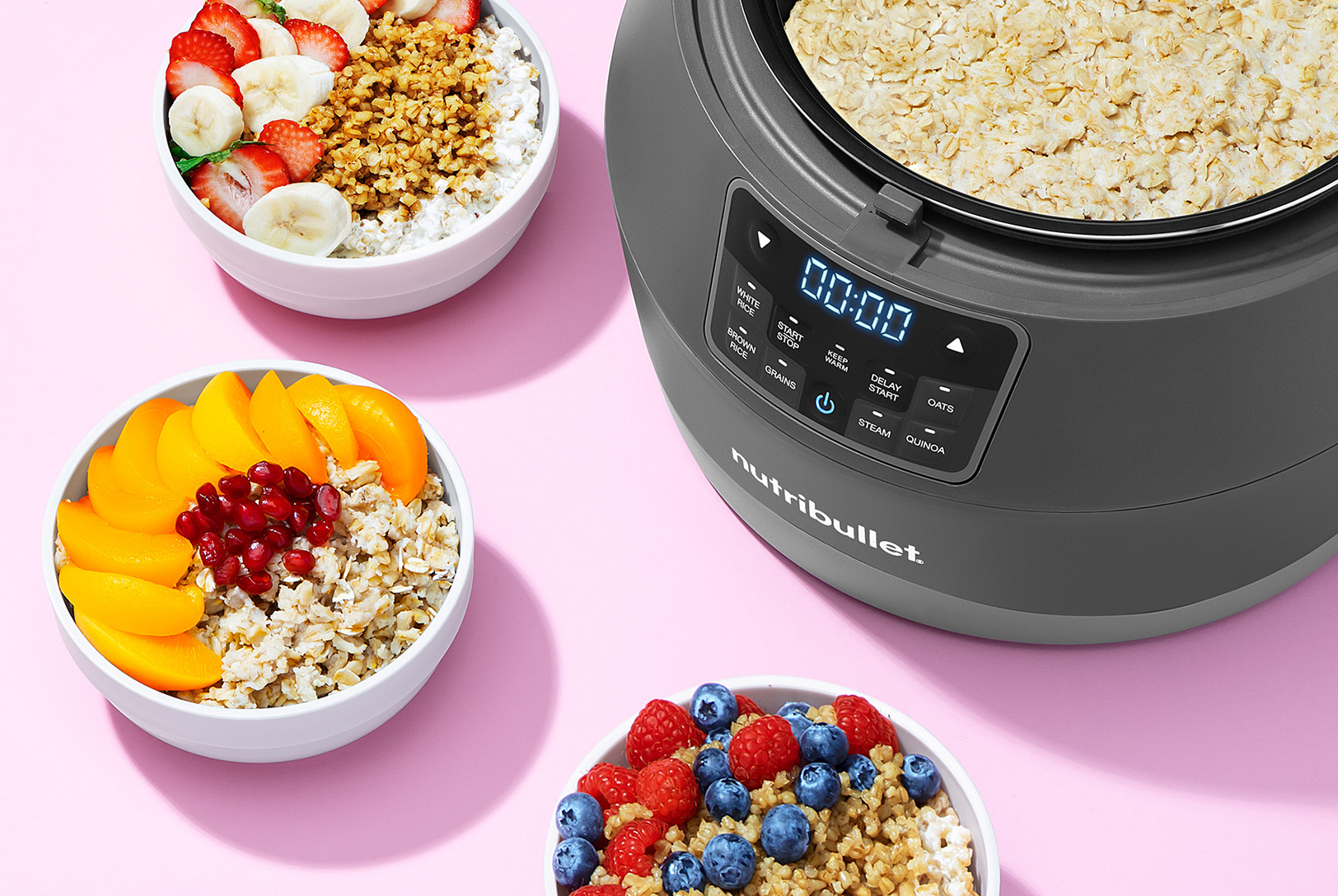 grain cooker steel cut oats with berries, bananas, and other fresh fruits