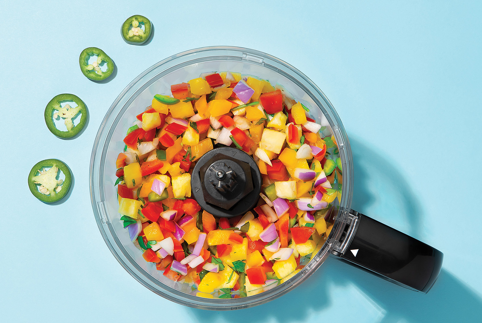pineapple salsa with jalapeno, onion, and tomatoes diced in food processor