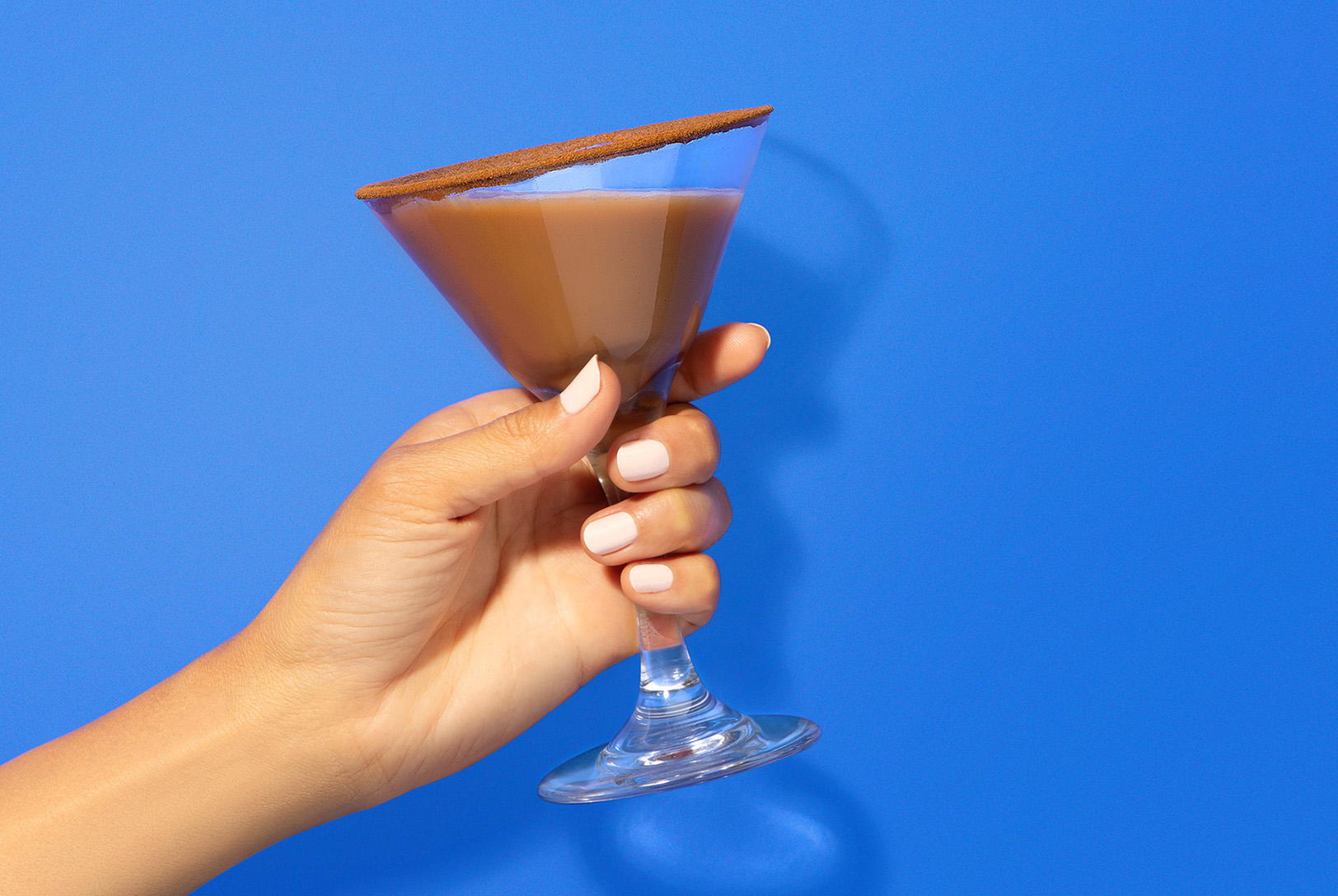 hand holding horchata coffee blend in martini glass