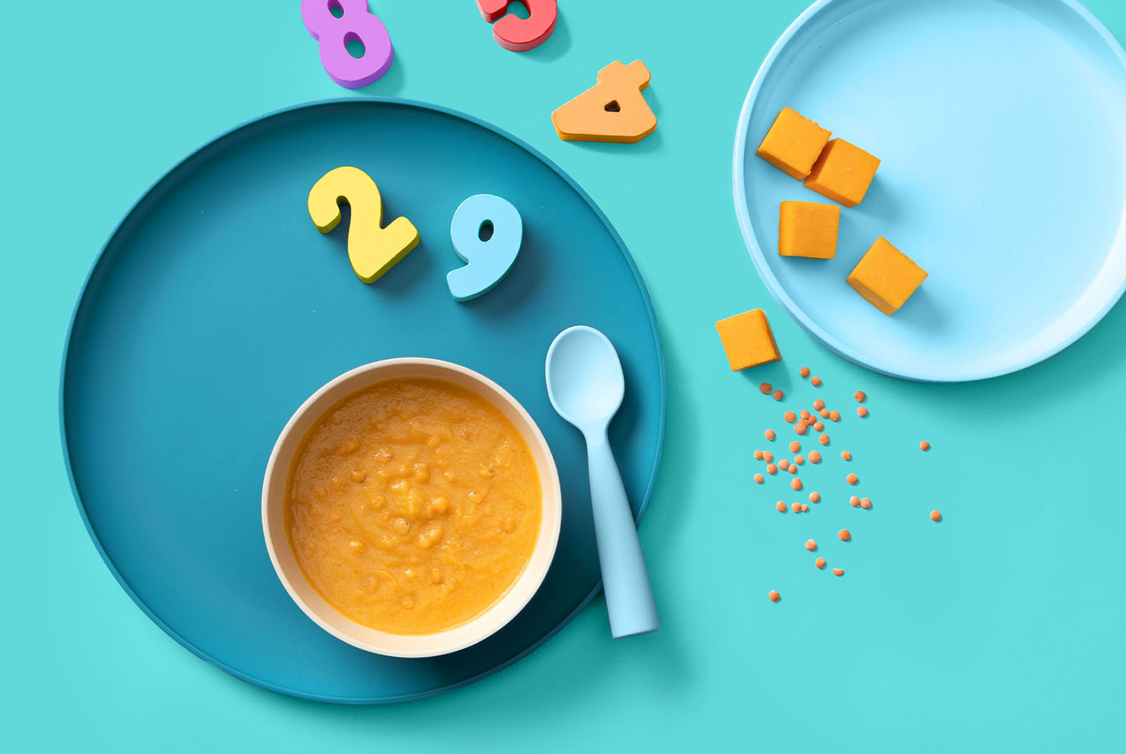 Butternut squash and lentil soup in a bowl on a plate