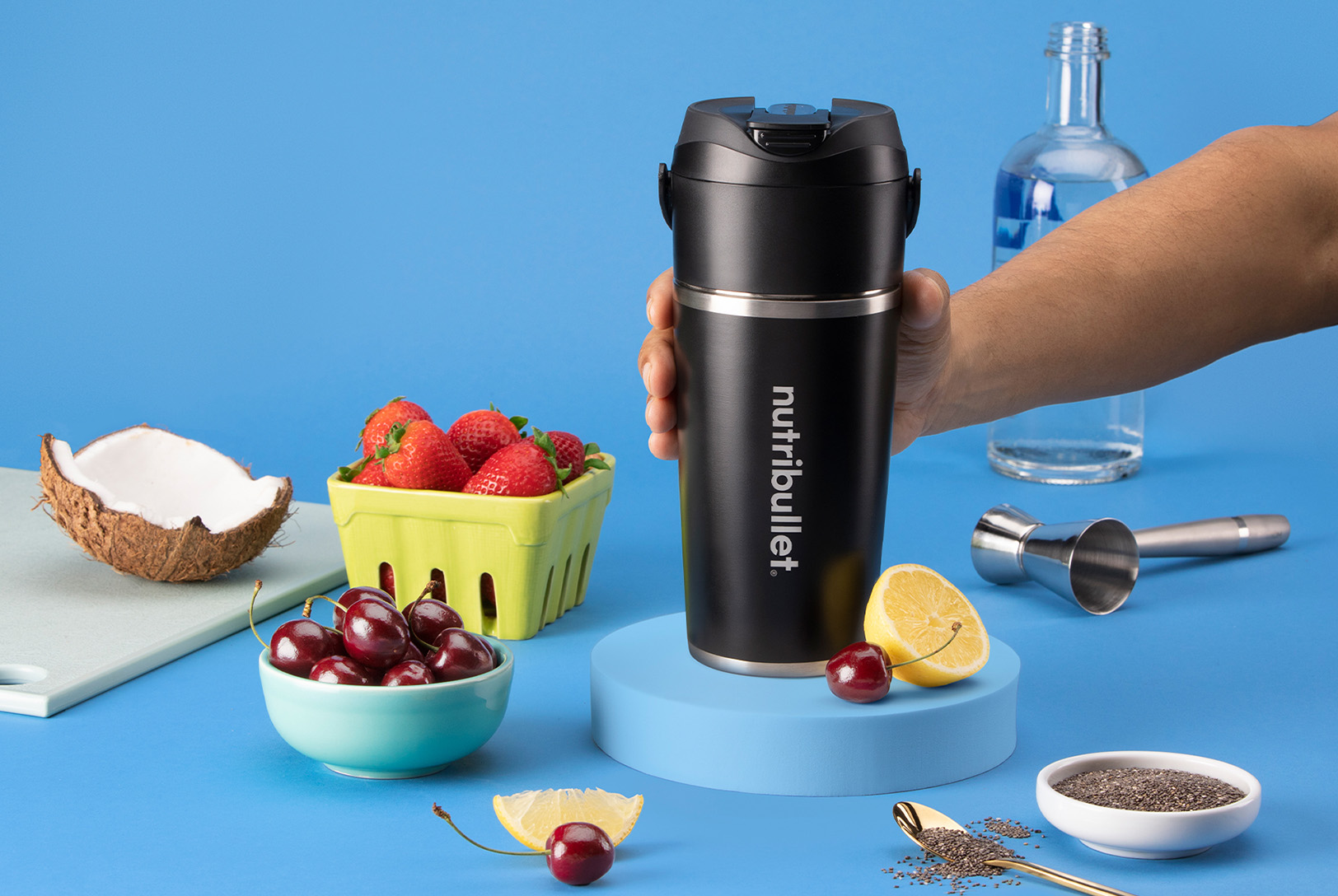 Black nutribullet Flip with cherries, strawberries, coconut, lemon, chia seeds, and vodka